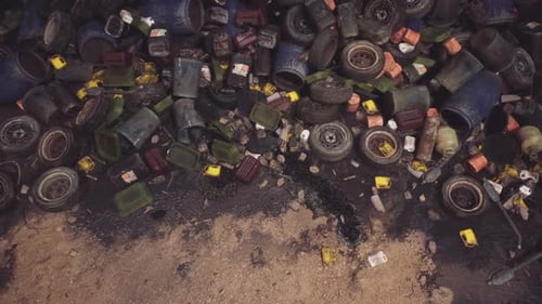 Abandoned Waste and Debris Scattered Across a Neglected Industrial Site at Dusk