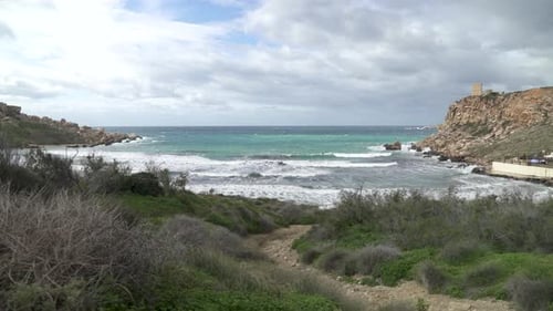 Path Leading to Ghajn Tuffieha Bay with Turquoise Colour Mediterranean Sea Raging in Winter