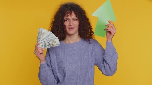 Woman Holds Cash and Upward Trending Arrow