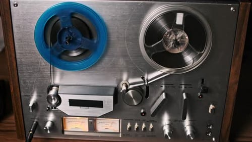 Vintage Reel-to-Reel Tape Recorder in Operation