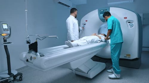 Patient Receiving CT Scan in Hospital Room