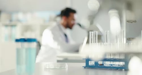 Glass vials, chemical and scientist with microscope in laboratory for pharmaceutical innovation