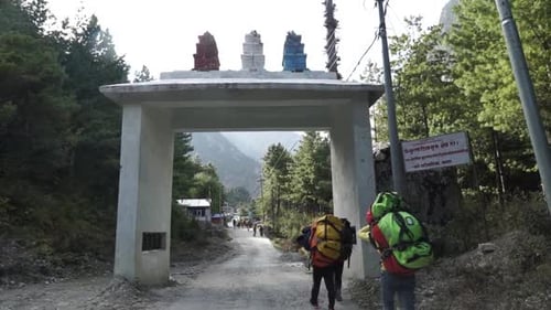 Hikers crossing the second Gate at Annapurna Circuit trek, Nepal