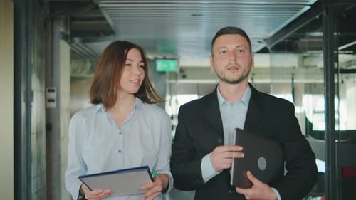 In a Modern Office Colleagues Engage in Professional Discussions Communicate Effectively and