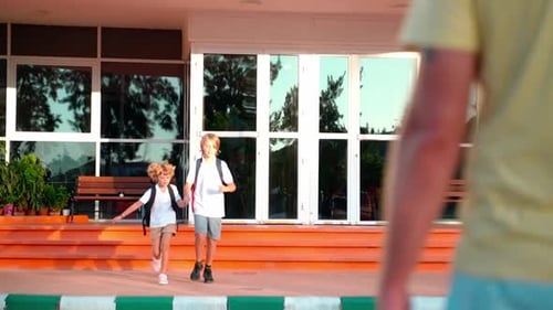 Students Running to Parents After Elementary Primary Middle School Classes or Break Back to School