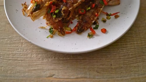 Crispy Fried Mantis Shrimp Topped with Chili and Onion