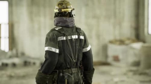 Firefighter Conducting Structural Assessment in Building Shell