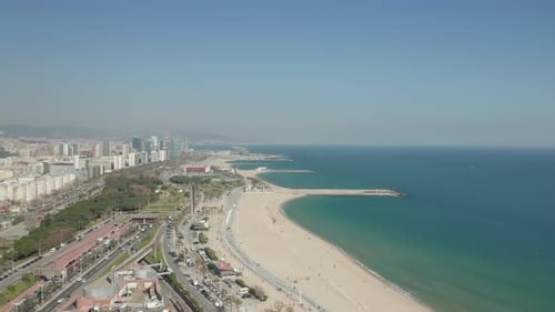 Aerial Footage of Sand Beach Along Sea Coast in City