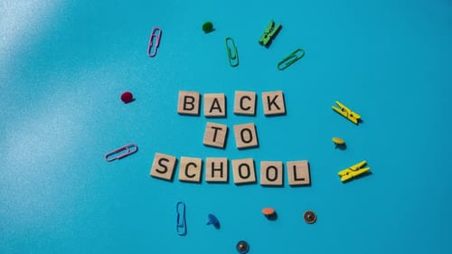 TIME LAPSE BACK TO SCHOOL Message Inscription Text on Wooden Blocks on Creative Colorful Blue