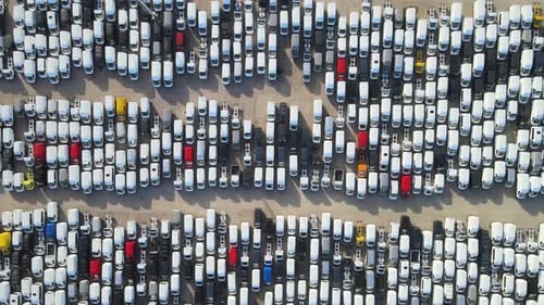 Aerial View of White Delivery Vans in Rows
