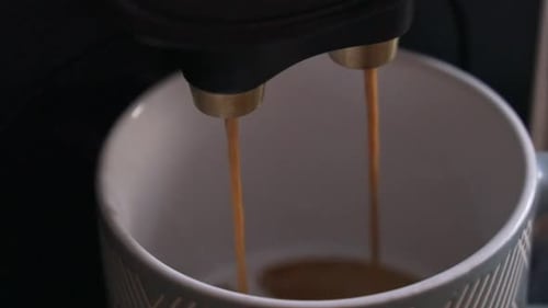 Espresso Machine Pouring Coffee into a Neutral Mug