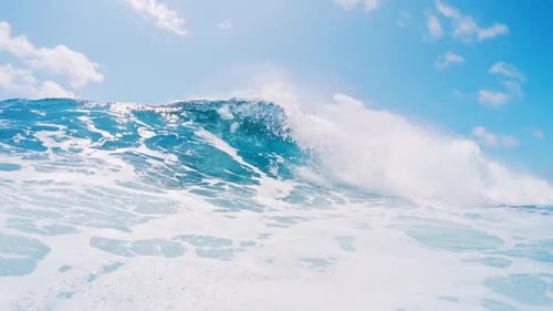Wave rolls and breaks. Ocean wave rolls and breaks over the flat reef bottom in Maldives