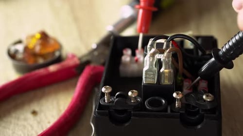 Electrical Component Being Tested with Tools