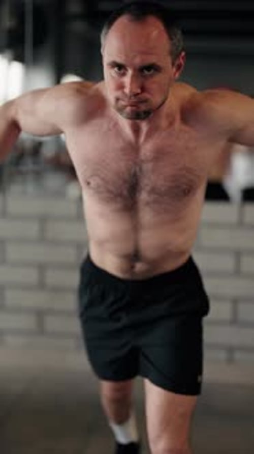 Strong Muscular Man Doing Chest Workout on Cable Crossover Machine