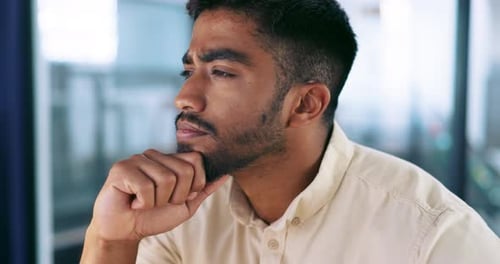 Man Thinking Carefully in Office Setting Close-Up