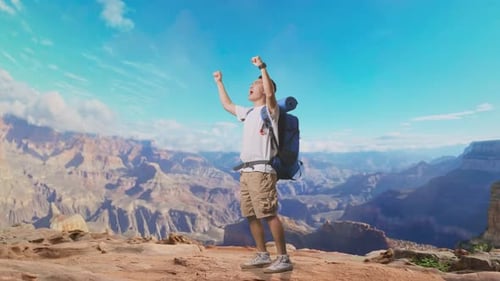 Asian Male Screaming Goal Celebrating The Success At The Top of Mountain