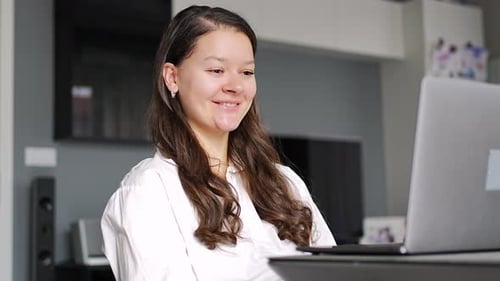 Young Woman on Video Call at Home