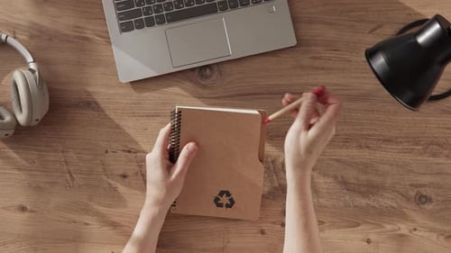 Top Down View of Girl Open Her Notebook Made of Ecofriendly Paper Andwrite TO DO LIST