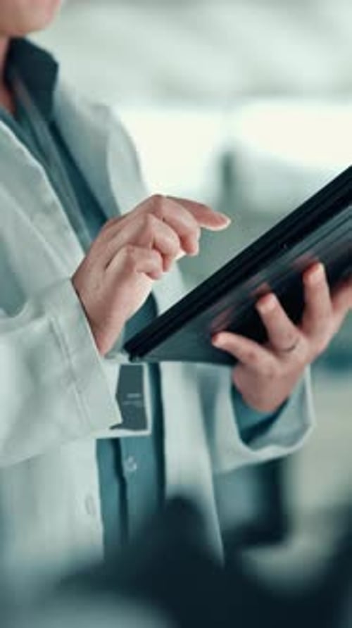 Medical Professional Using Tablet in Workplace