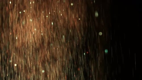 Fond bokeh flou défocalisé avec des étincelles dorées