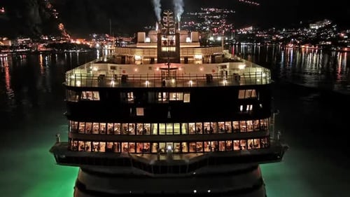 Illuminated Cruise Ship in Sea at Night