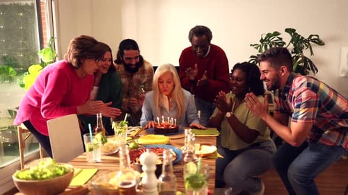 Friends Celebrate Woman's Birthday with Cake