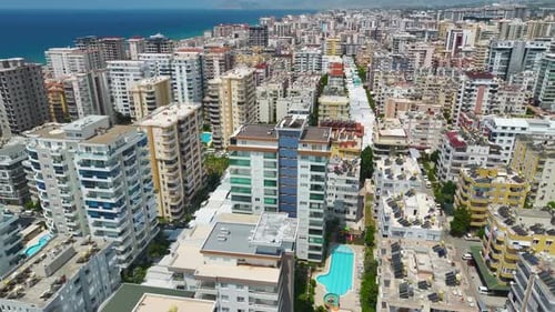 Coastal City Buildings and Turquoise Ocean Water From Above