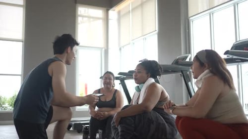 chubby women workout at fitness center.