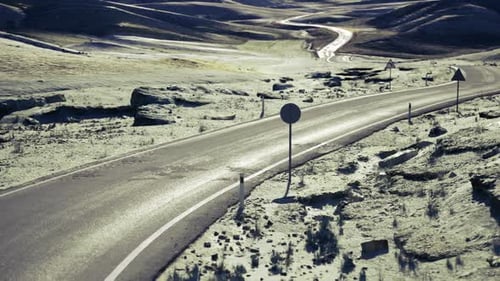 Winding Route with Lone Marker Curvy Road Marked By Solitary Post