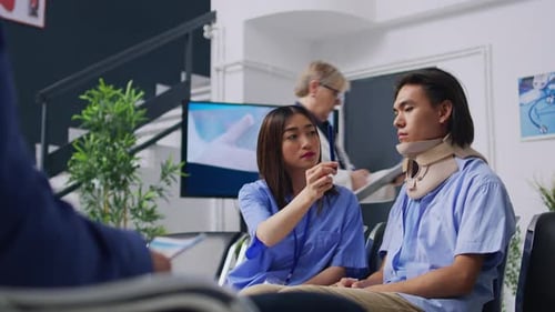 Medical Staff Talking to Patient in Waiting Room