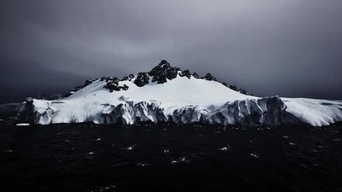 Hostile Ocean Scene with Snowcapped Heights and Turbulent Waves