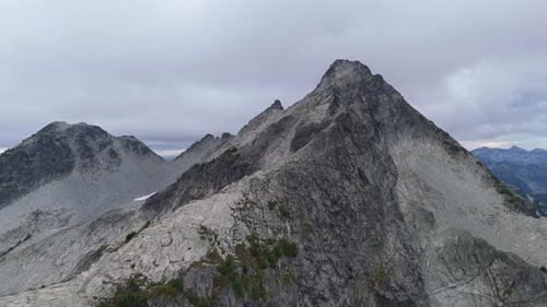 Majestic Rocky Mountain Peaks Dominate the Rugged British Columbia Landscape Under a Dramatic Sky