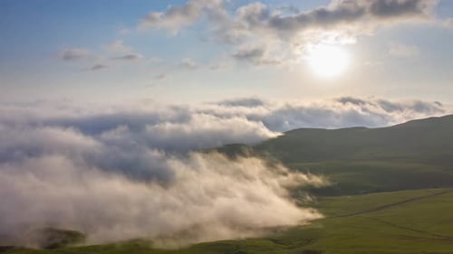 Drone Hyperlapse Of Clouds Creeping Over Mountain Valley At Sunset In Tkhilvana, Georgia