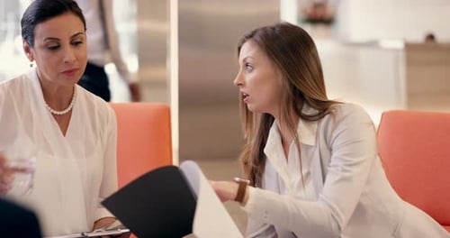 Business people in meeting with manager checking document report or review of company growth