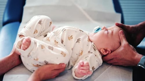 Infant Receiving Gentle Chiropractic Care in Clinic