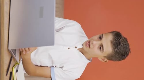 Young Adult Communicating on Laptop in Portrait Orientation