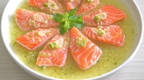 Fresh Salmon Slices in Lime Sauce Close Up