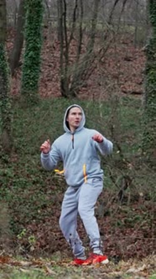 Warrior Practicing Techniques Person Executing Spinning Kicks In Forest With Focused Attitude
