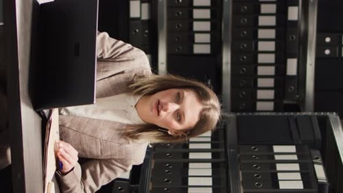 Professional Woman Working at a Busy Office Desk