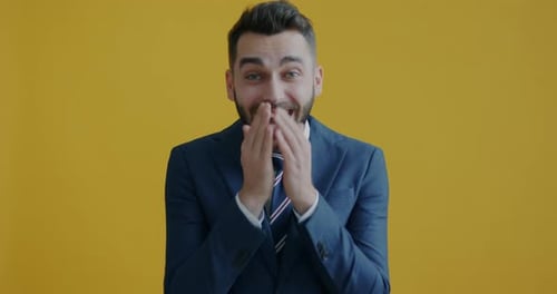 Young Man in Suit Celebrates Success