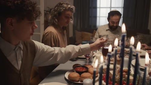 Family Celebrates Hanukkah Meal at Home