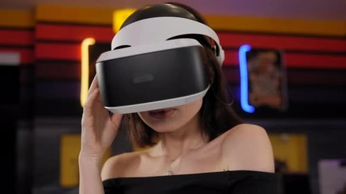 Woman Using VR Headset in Colorful Room