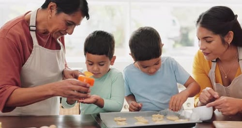Family Baking Cookies Together in Bright Home Kitchen