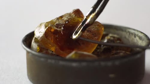 Dab Tool Scooping Up Cannabis Concentrate Close Up