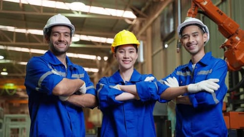 Portrait Group of male and female industrial worker working in factory. Attractive manufactory indus