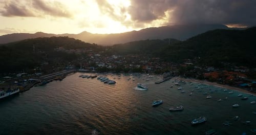 Pantai Padang Bai, Bali in Indonesia. Aerial drone view at twilight