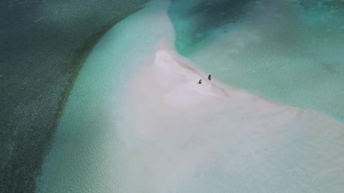 Aerial View of Sandbar with Figures in Tropical Ocean