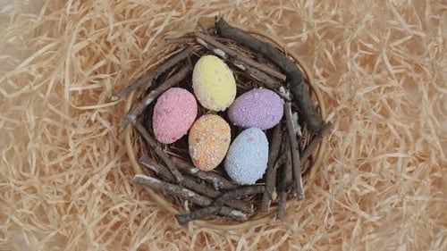Colorful Easter eggs in the nest rotate