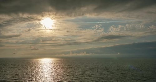 Romantic colorful sunset at the sea. Against the background of the sea, the sun goes down