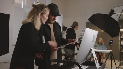 Design Team Reviewing Layout in Studio